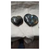 Two heart shape labradorite polished rocks.