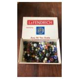 LaFendrich Cigar box of assorted marbles