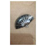 Sterling fan brooch. Sticker residue on front