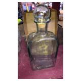 Large apothecary bottle with cork stopper nearly