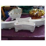 4 ceramic flower frogs   Marked 693 Germany.