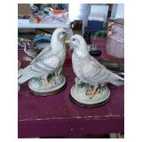 A pair of ceramic dove statues. Label reads