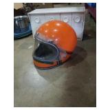 Vintage orange motorcycle helmet