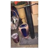 Metal stand says B&w candle and vase