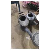 2 watering cans and bait bucket