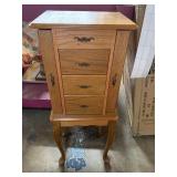 Armoire style jewelry box loaded with fashion