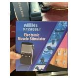 Electronic muscle stimulator mini masseuse new in
