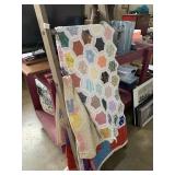 Three quilts and ladder display rack