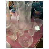 Picture with six juice glasses chip on one of the