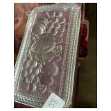 Clear glass refrigerator dish has small chip on