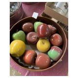 Wooden bowl with wooden apples red yellow and