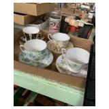 4 fancy cups and saucers one has been repaired
