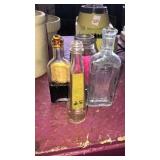 5 old bottles, 1 inside another