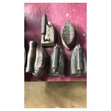 5 old handheld irons including Asbestos Sad Iron