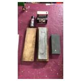 2 containers of BBs and 2 sharpening stones