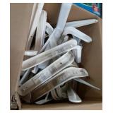A large box of white shelf brackets