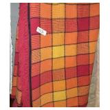 Red and yellow with black trim and Friends throw