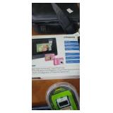 Polaroid camera and digital frame. Appears to be