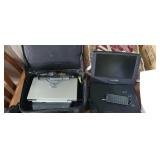 Pair of portable DVD players. One with case and