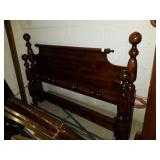 Wood bed. 61 in. Has rails.