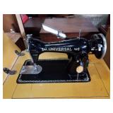 Universal sewing machine in cabinet. 22x17x30.