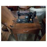 Singer sewing machine in cabinet. 22x17x30.