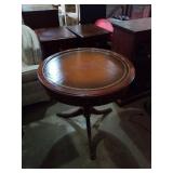 Round leather top, claw foot table. 26x26