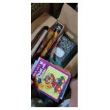 Group with composition notebooks, coloring books