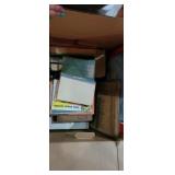 Box of old books and some Halloween decorations