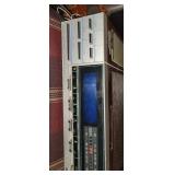 Vintage alarm clock, sprint phone, and camera