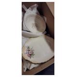 Box of mismatched dishes