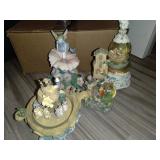 4 wind up musical statues