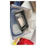 Box of Tupperware, bread pans, pitchers.