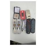 Lot of remotes, tape recorder, heating device and