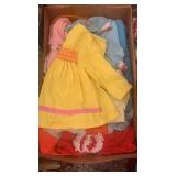 Box of doll clothes.