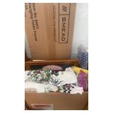 Box of new dish towels, picture frames, hanging