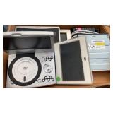 Flat of electronics.  WiFi modem, CD ROM, iCraig,