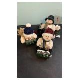 3 snowman on sleds