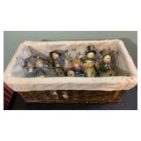 4 metal snowmen with other figurine and basket