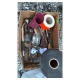 Box of tools, rubber conveyer belt, orange tape