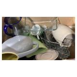 Box of glass vases, plates, bread pan, candle