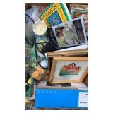 Flat with alarm clock, pictures, candles books