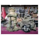 2 frog statues