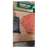 Leather pistol holster and sccy 9mm magazine Leather pistol holster and sccy 9mm magazine