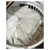 Dish towels, bath towels & more in laundry basket Dish towels, bath towels & more in laundry basket
