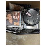Portable CD player and bunch of CDs Portable CD player and bunch of CDs