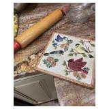Old time rolling pin and ceramic trivets