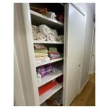 Hall closet full of towels, throws and more