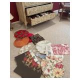 3 drawers full of holiday towels, placemats,