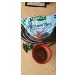 Garden hose, potting soil, pots and sprinklers